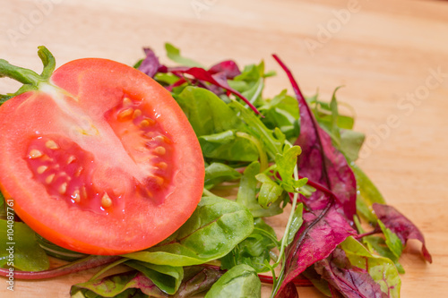 red cut tomato with the salad