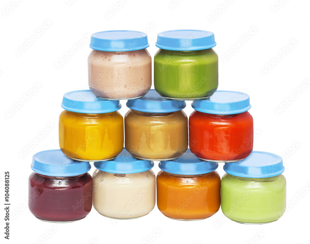Pyramid from bright multi-colored cans with baby food with covers, isolated on the white Pyramid from bright multi-colored cans with baby food with covers, isolated on the white