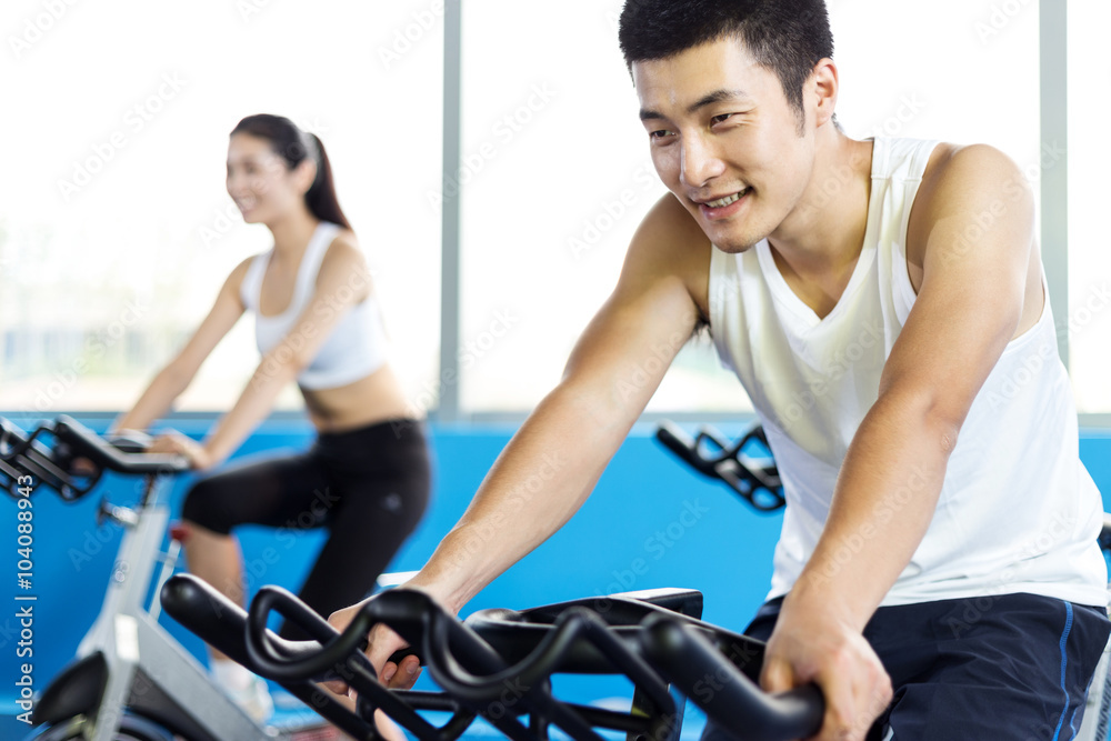people working out in modern gym people working out in modern gym