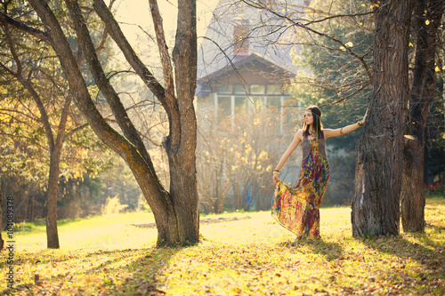 Girl in autumn park near the house © zagursky
