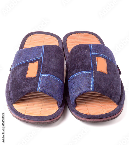 Pair of blue textile slippers on white background closeup