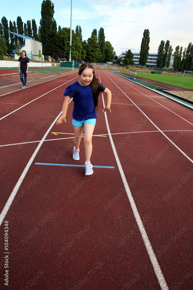 Little girl have fun on the stadium