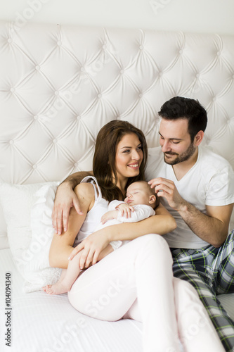Happy family with newborn baby