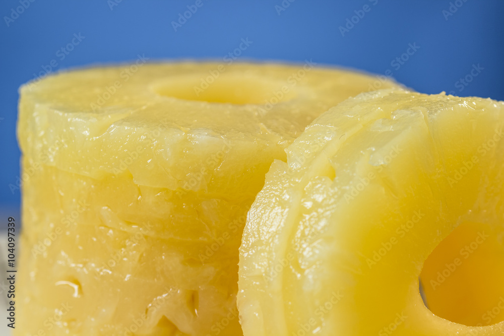 Close-up of canned pineapple slices, preserved at its own juice Close-up of canned pineapple slices, preserved at its own juice
