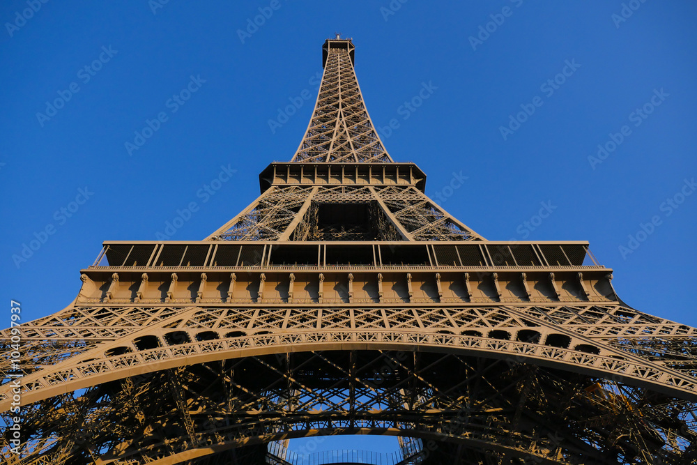Low Angle View Of Eiffel Tower Against Blue Sky