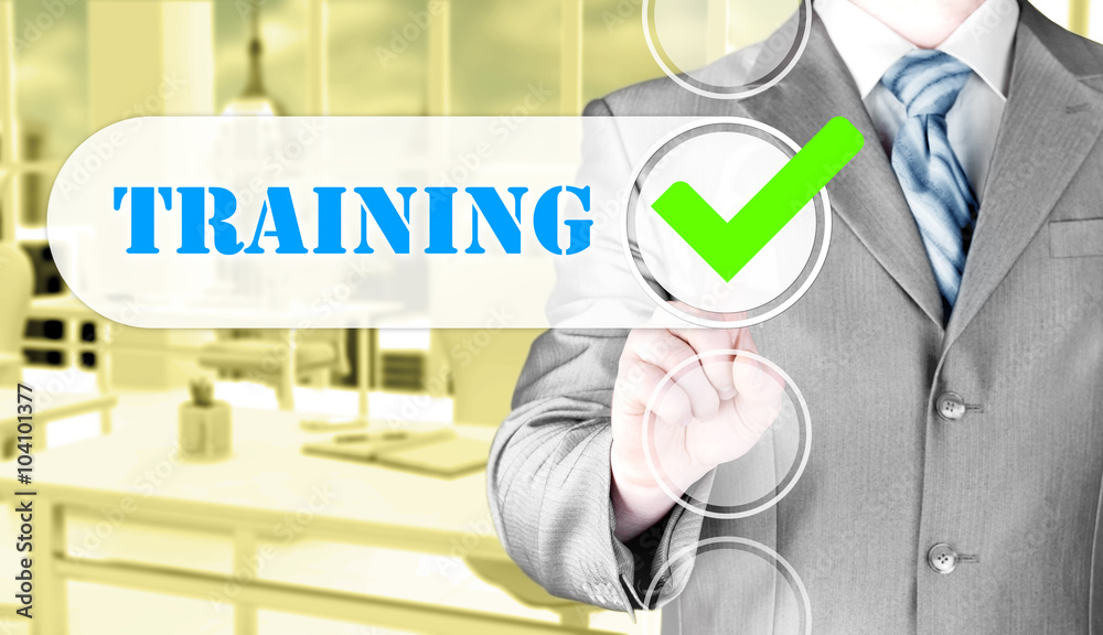 Businessman pressing touch screen interface training checkbox Businessman pressing touch screen interface training checkbox