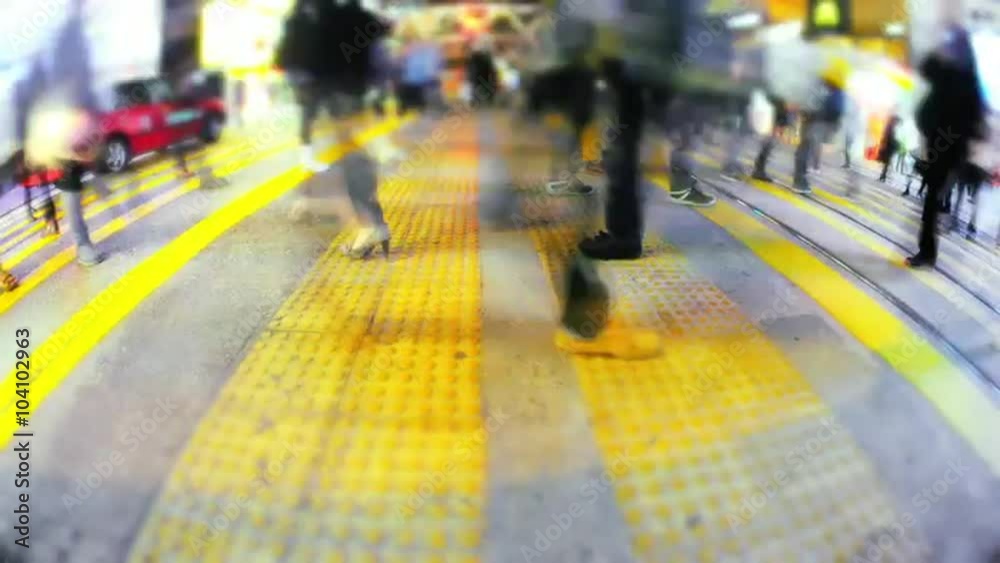People move fast on busy crosswalk in Asian metropolis at night timelapse video