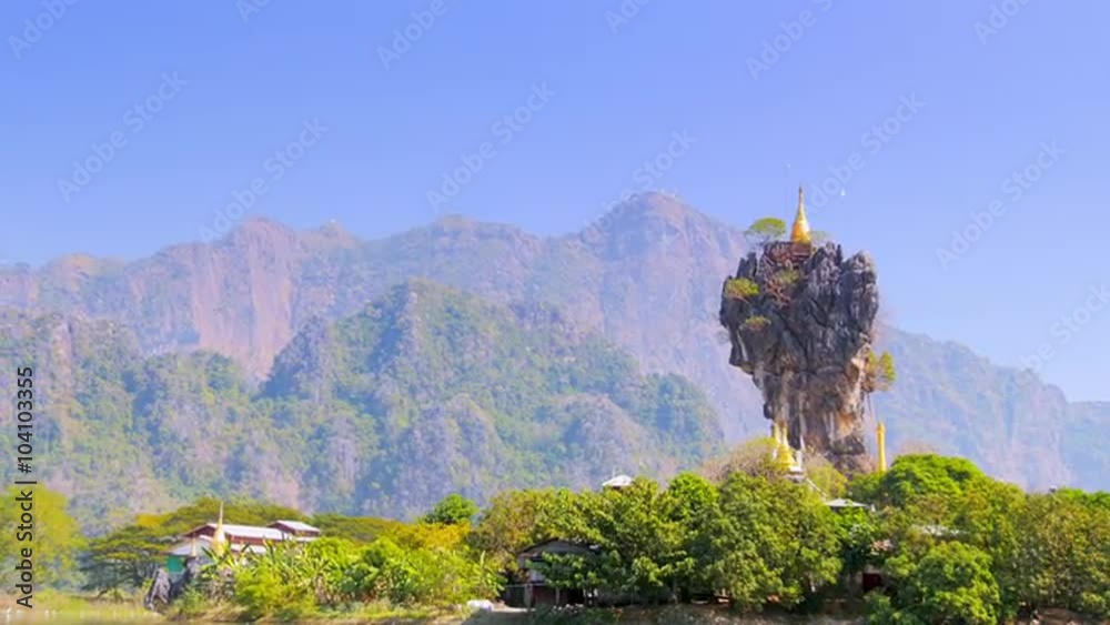 Scenic and extraordinary Buddhist Kyaut Ka Latt Pagoda located in the middle of lake in Hpa-An city in Myanmar (Burma)