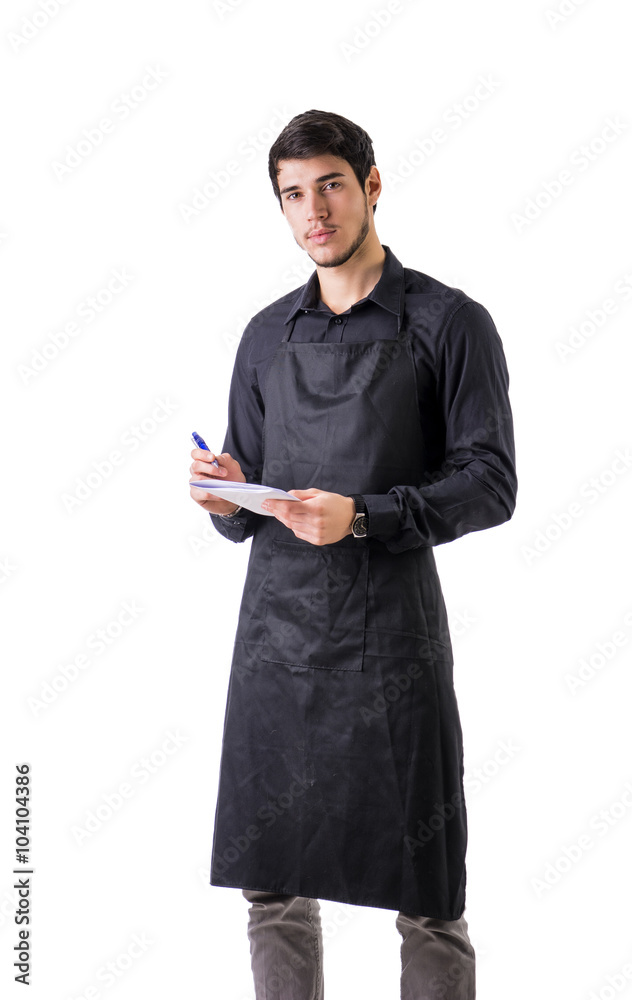 Young chef or waiter wearing black apron isolated Young chef or waiter wearing black apron isolated