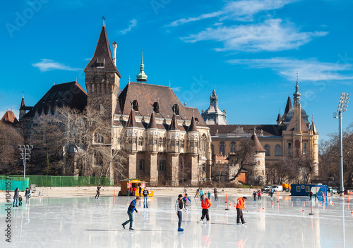 People are skating in front of Vajdahunyad castle in Budapest, Hungary.