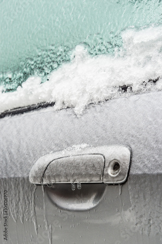 Montreal, CA, 29th February 2016. Car handle is covered with ice after freezing rain. © mbruxelle