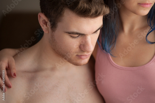 Close Up of Young Man and Woman Cuddling