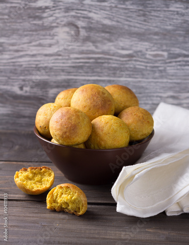Wallpaper Mural Vegetarian orange buns in ceramic bowl on wooden table Torontodigital.ca