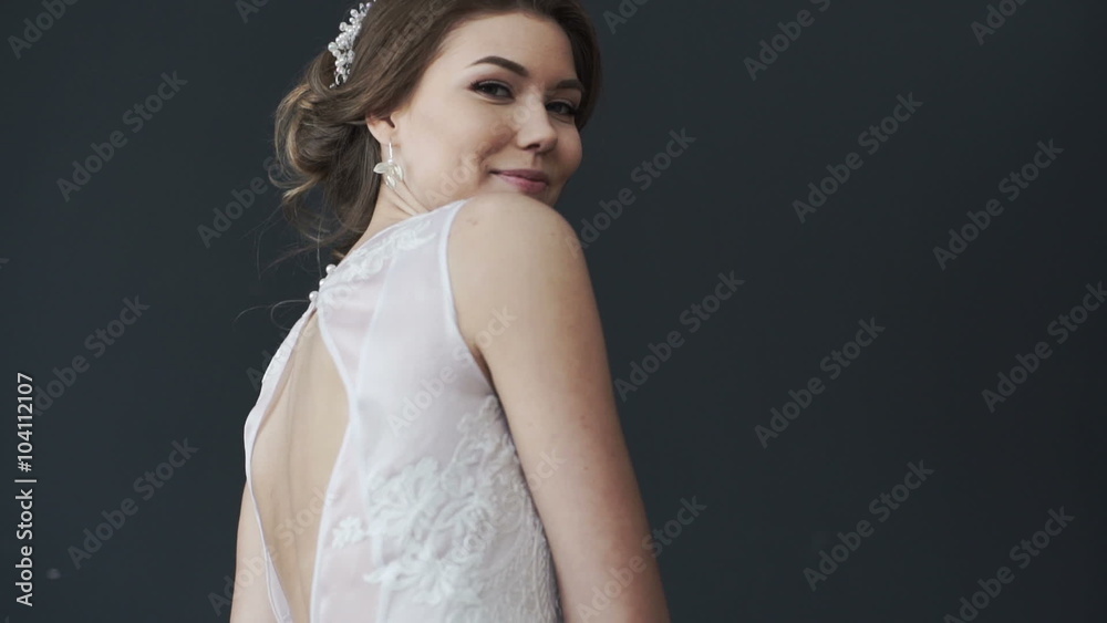Beautiful young bride in white wedding dress spinning. Pretty woman Beautiful young bride in white wedding dress spinning. Pretty woman