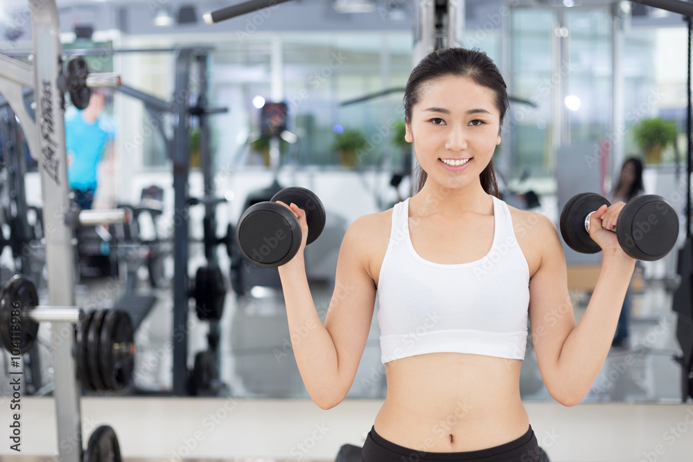 beautiful girl working out in mdoer gym beautiful girl working out in mdoer gym
