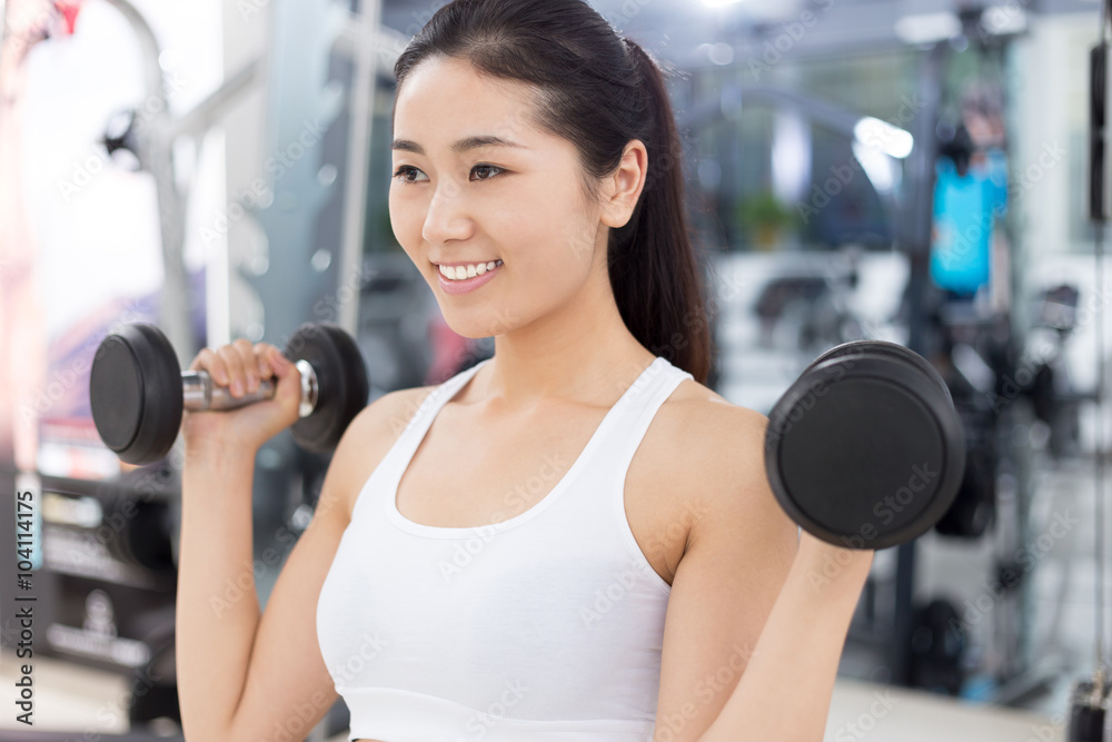 beautiful girl working out in mdoer gym beautiful girl working out in mdoer gym