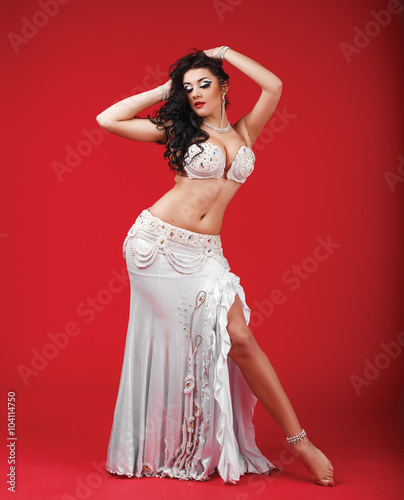 Beautiful belly dancer in the studio
