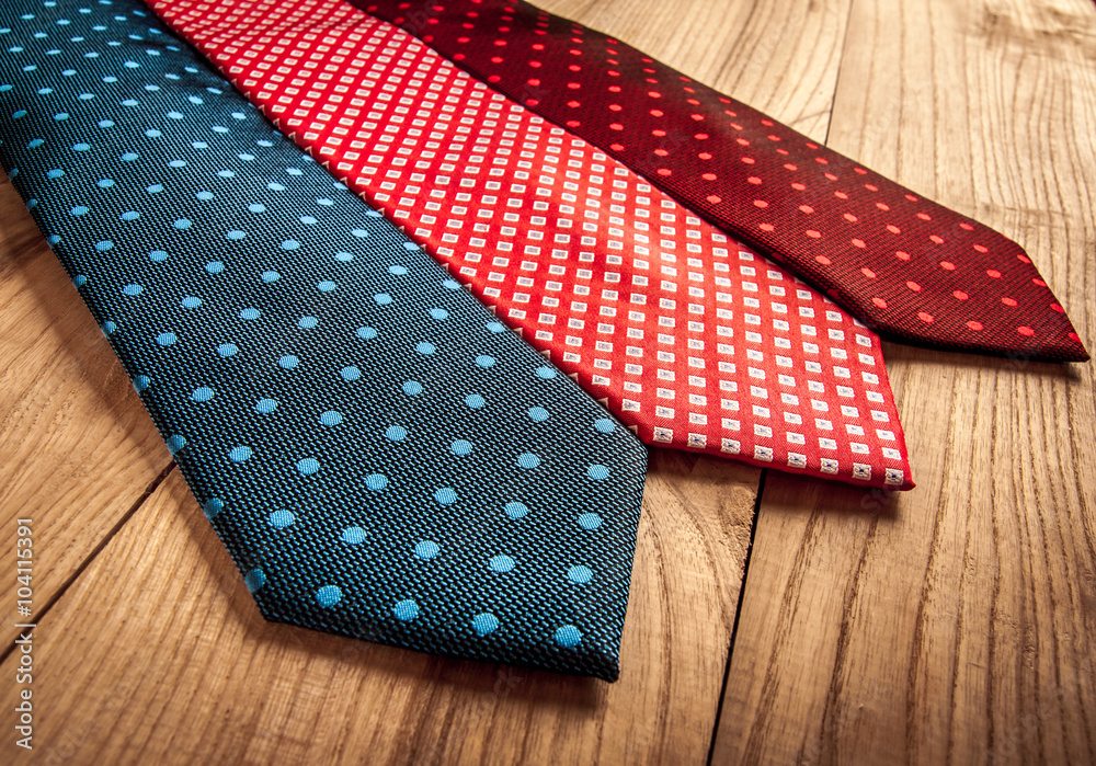 Fathers day composition of three ties hang on wooden wall backround. Fathers day composition of three ties hang on wooden wall backround.