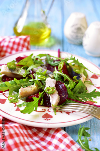 Fresh salad from beetroot,herring,arugula and chard leaves.