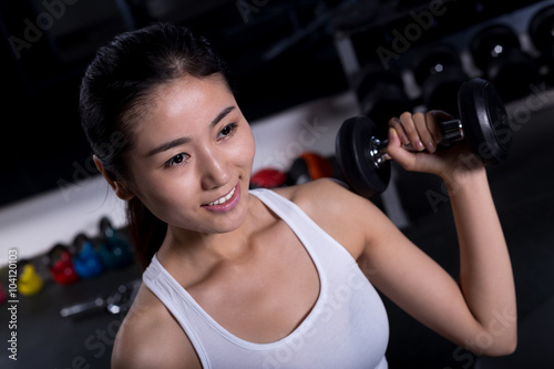 beautiful girl working out in moder gym