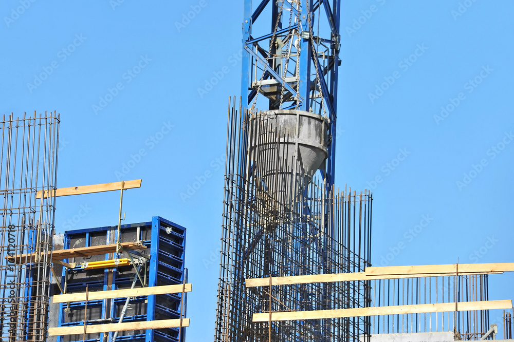 Crane lifting cement mixing container Crane lifting cement mixing container