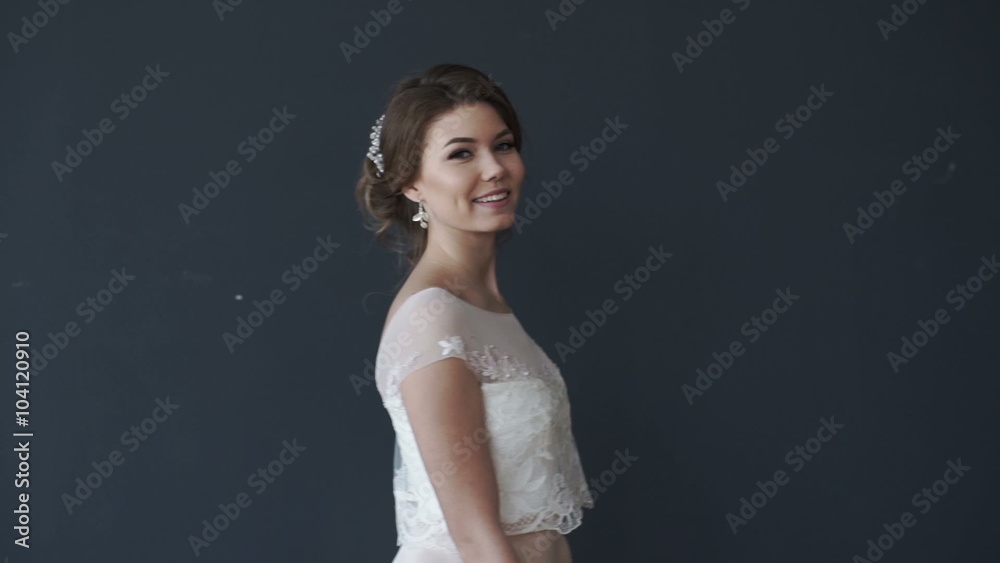 Beautiful young bride in white wedding dress spinning. girl smiling Beautiful young bride in white wedding dress spinning. girl smiling