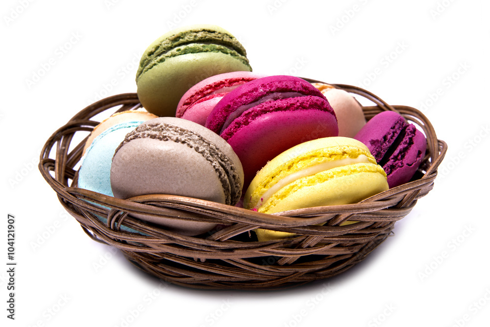 French Macaroons in basket isolated on white French Macaroons in basket isolated on white