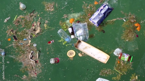 Garbage floats in the sea. Muddy water. Abuse of environment photo