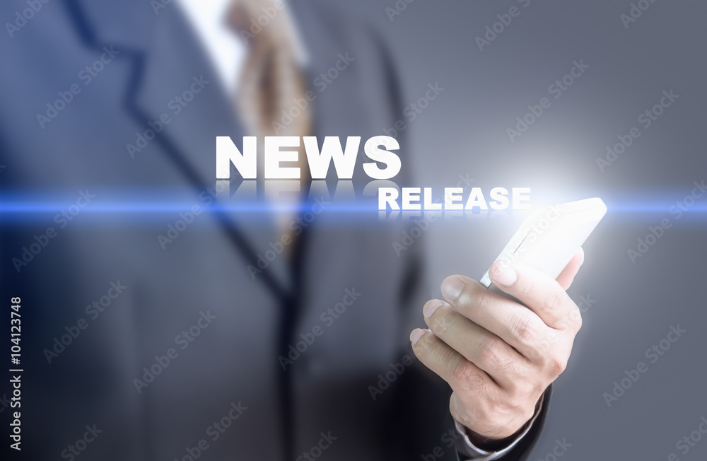 Businessman pressing hand News Release word on virtual screen. Can bring to the medium of your ad. Businessman pressing hand News Release word on virtual screen. Can bring to the medium of your ad.