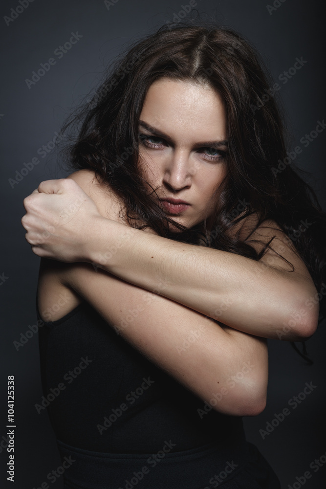 High fashion sensual girl in the black dress in the studio High fashion sensual girl in the black dress in the studio