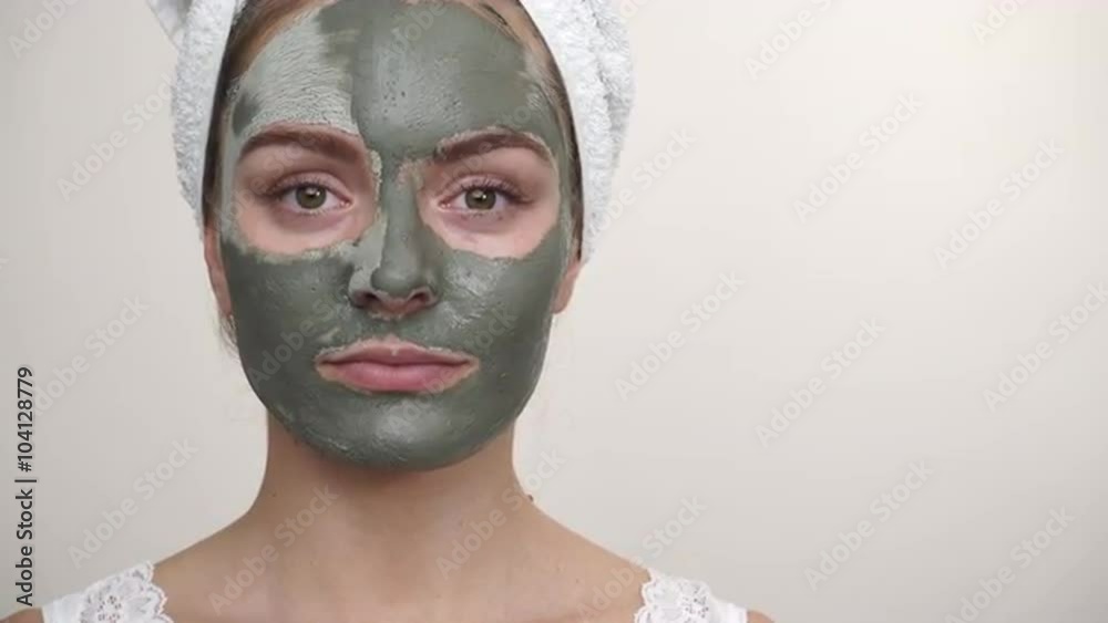 Woman with green clay mud mask on face 4K Woman with green clay mud mask on face 4K