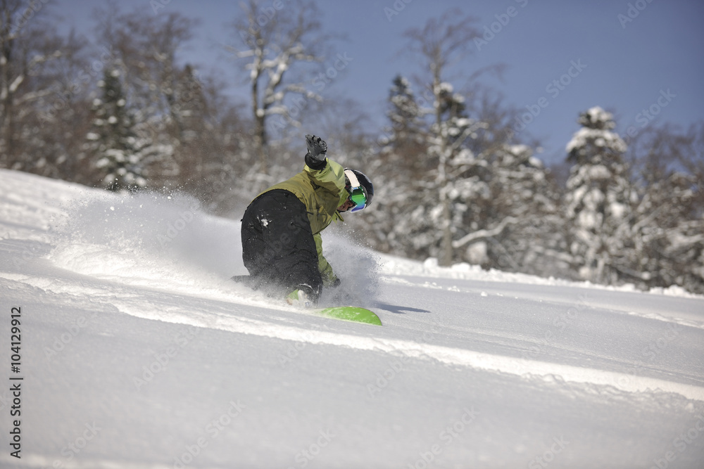 snowboarder woman enjoy freeride on fresh powder snow