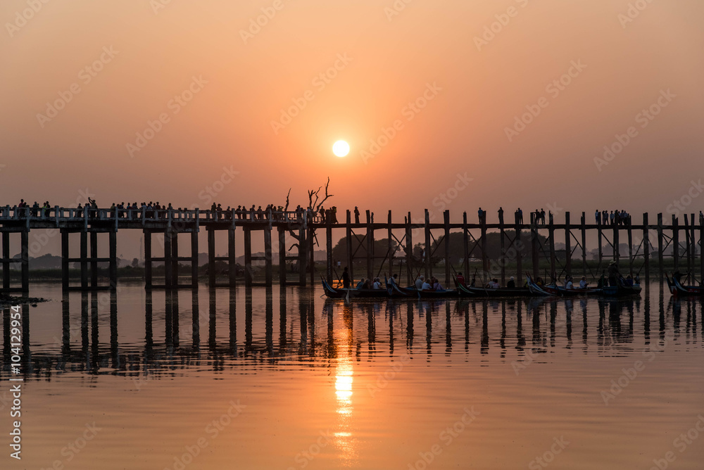 Silhouetted on U Bein Bridge at sunset, Amarapura, Mandalay regi
