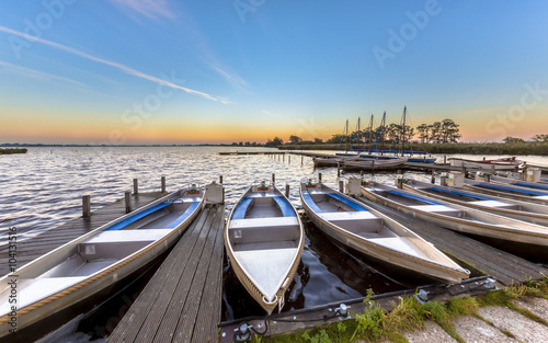 Small rental boats in a marina in summer