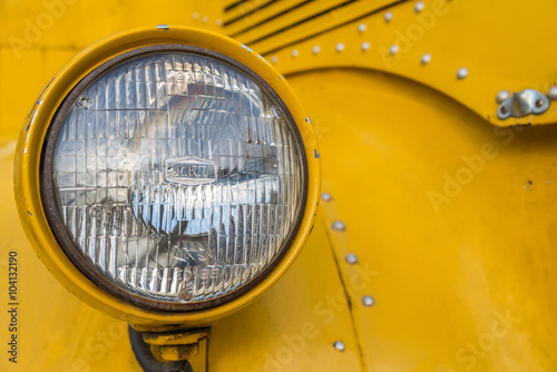 Front lamp of yellow school bus
