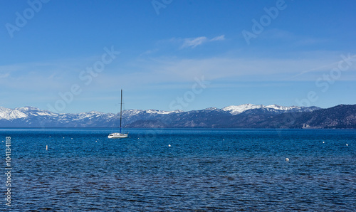 Moored sailboat in a mountain lake.