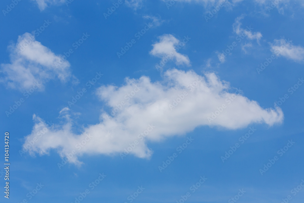 fluffy cloud on clear blue sky background