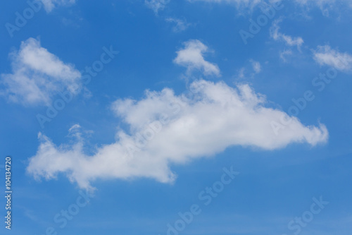 fluffy cloud on clear blue sky background