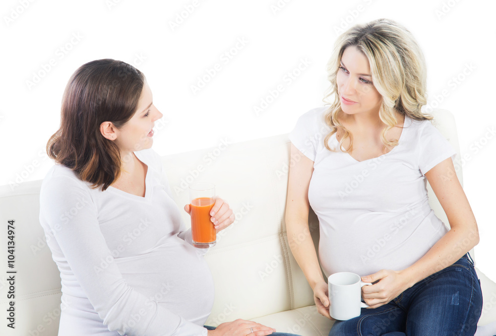 Two beautiful pregnant women with carrot juice Two beautiful pregnant women with carrot juice