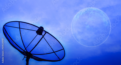 Fotografi Satellite dish under moon night sky