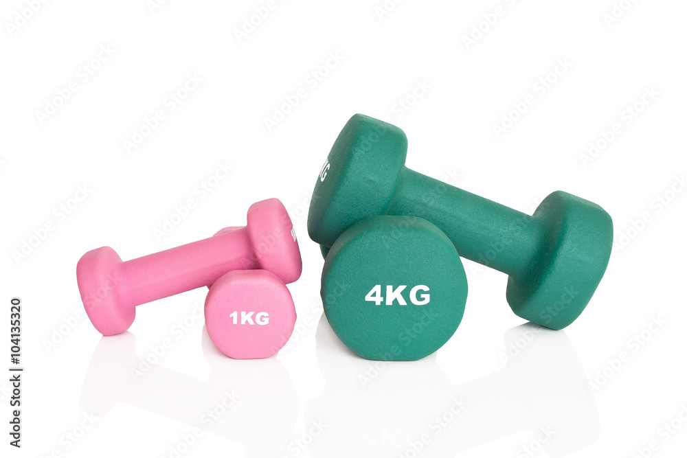 Fitness dumbbells. Green 4 kg and 1 kg pink dumbbells isolated on white background. Weights for a fitness training. Fitness dumbbells. Green 4 kg and 1 kg pink dumbbells isolated on white background. Weights for a fitness training.