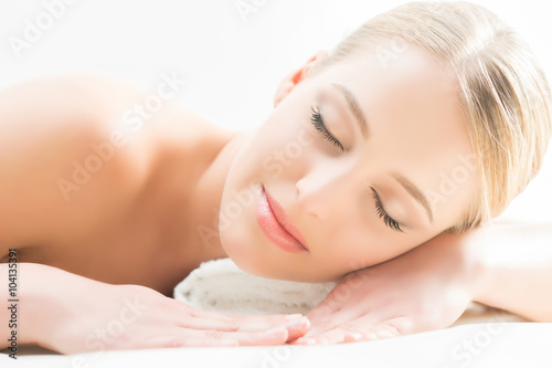 Beautiful girl sleeping and have a spa treatment isolated on white.