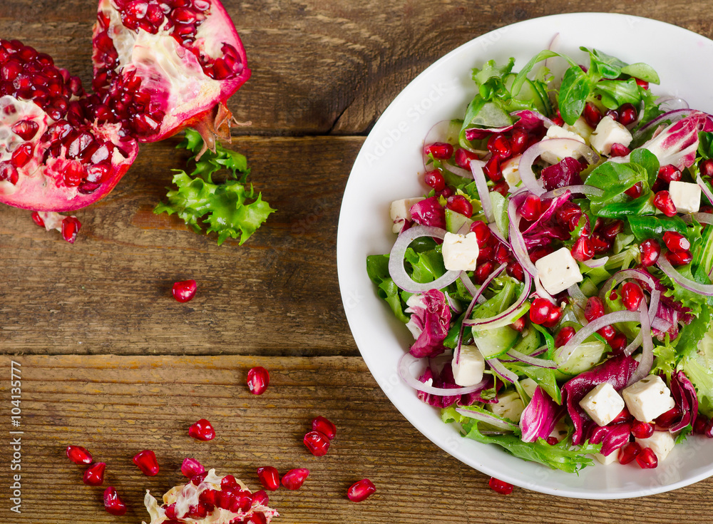 Fresh healthy salad with feta and pomegranate. Fresh healthy salad with feta and pomegranate.