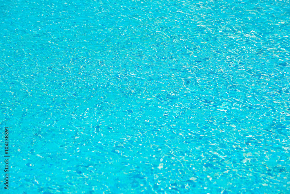 blue swimming pool with sunny reflections abstract for backgroun