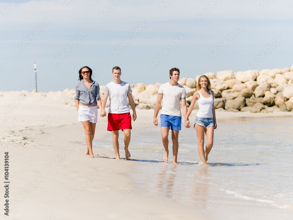 Company of young people on the beach