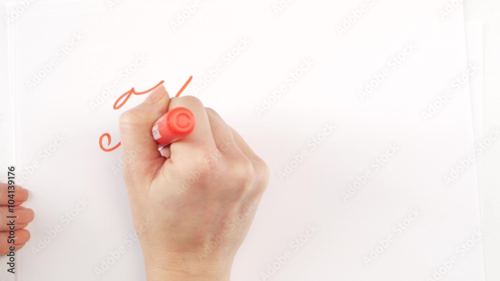 Hand of woman writing goal happy on paper Hand of woman writing goal happy on paper