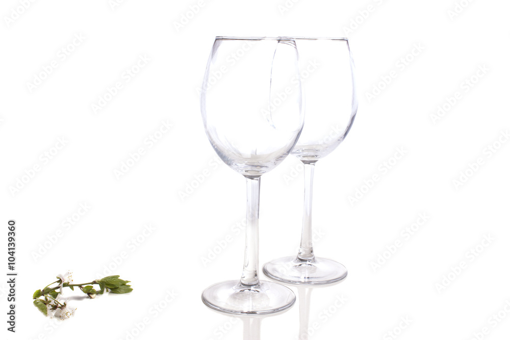 Fototapeta premium two empty glasses with cherry blossom