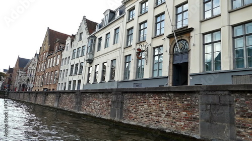 BRUGES, BELGIUM - OCTOBER 13, 2015: Scenic city view of Bruges, Belgium, canal Spiegelrei with beautiful medieval houses.