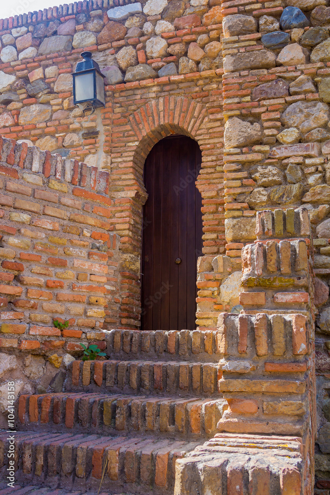 Ancient brick passageway door in the famous La Alcazaba in Malaga spain