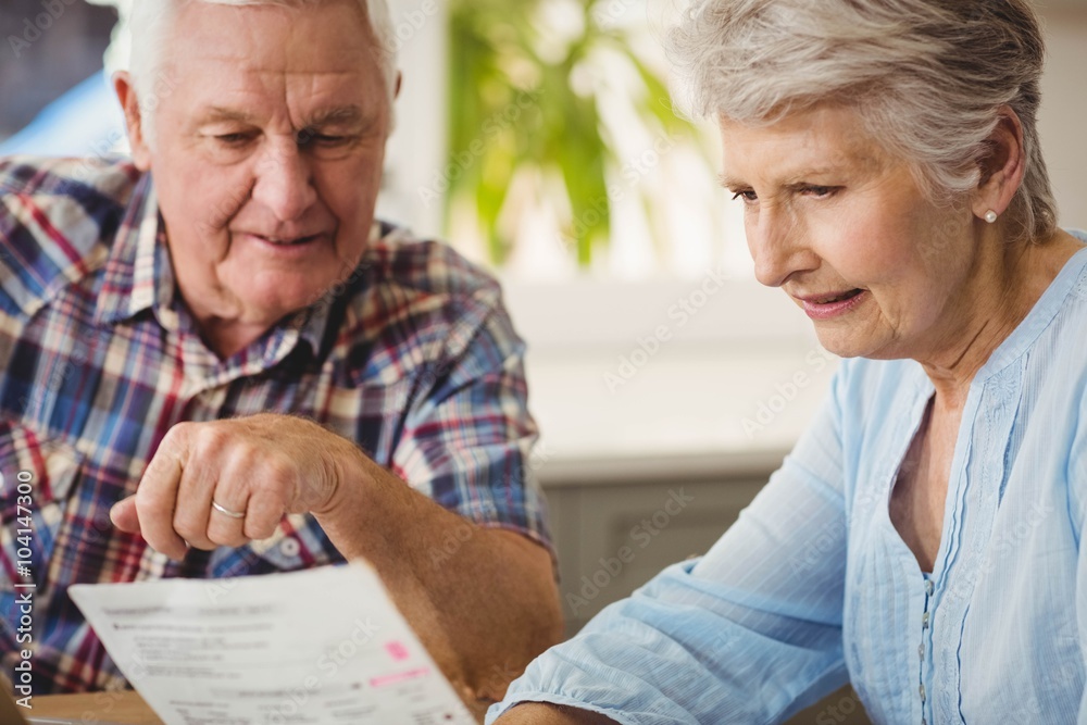 Senior couple discussing their bills